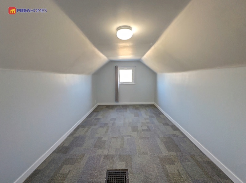 Fourth bedroom on the upper level with carpet flooring